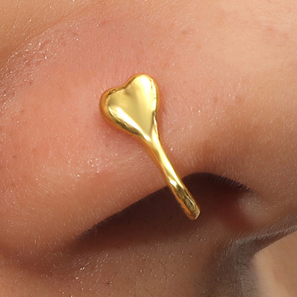 Zircon U-Shaped Leaves Heart Nose Studs showcased on a model's nose featuring a gold heart design.